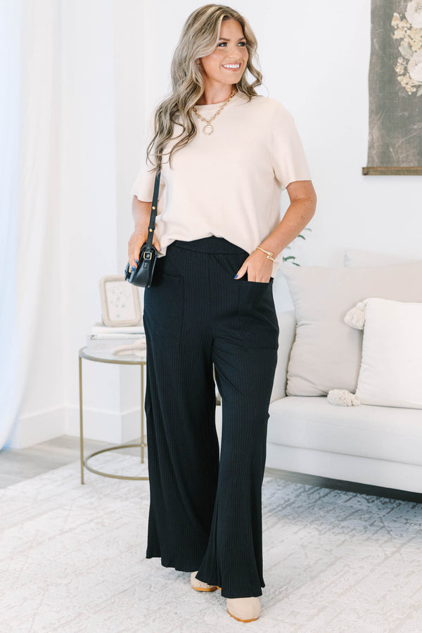 Plus Size black wide-leg ribbed knit pants with an elastic waistband and front patch pockets.