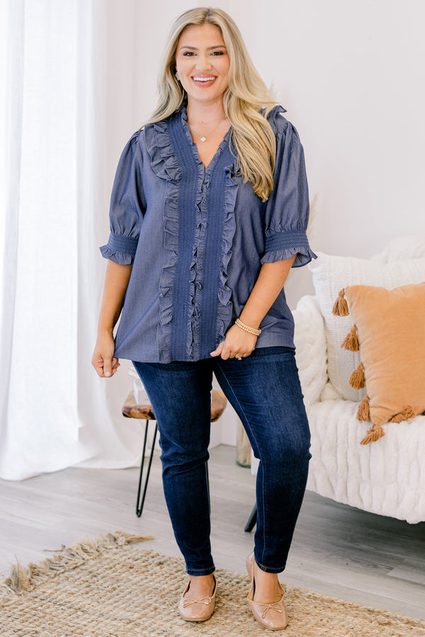 Chic Soul plus size clothing, chambray top with half sleeves that have a ruffle detail at the end of each sleeve as well as ruffles going down the center of the shirt