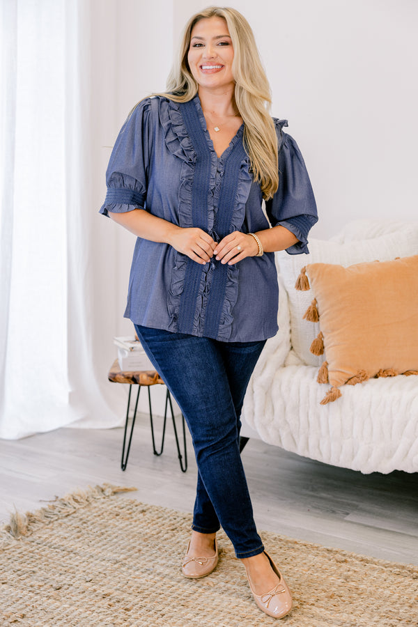 Chic Soul plus size clothing, chambray top with half sleeves that have a ruffle detail at the end of each sleeve as well as ruffles going down the center of the shirt