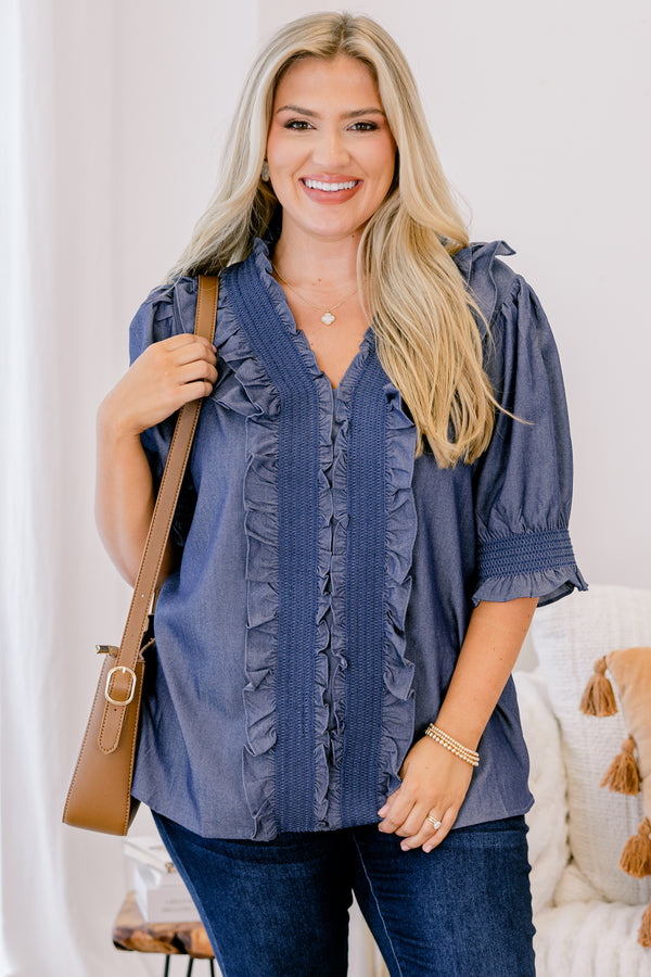 Chic Soul plus size clothing, chambray top with half sleeves that have a ruffle detail at the end of each sleeve as well as ruffles going down the center of the shirt