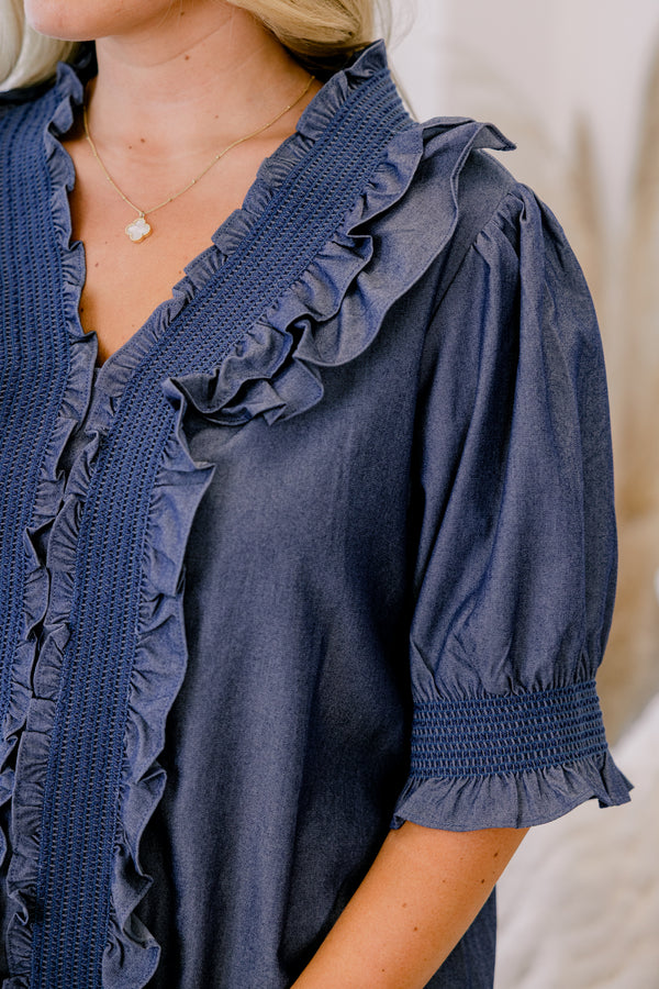 Chic Soul plus size clothing, chambray top with half sleeves that have a ruffle detail at the end of each sleeve as well as ruffles going down the center of the shirt