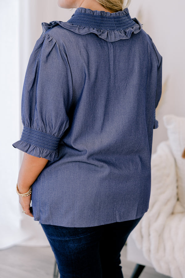 Chic Soul plus size clothing, chambray top with half sleeves that have a ruffle detail at the end of each sleeve as well as ruffles going down the center of the shirt
