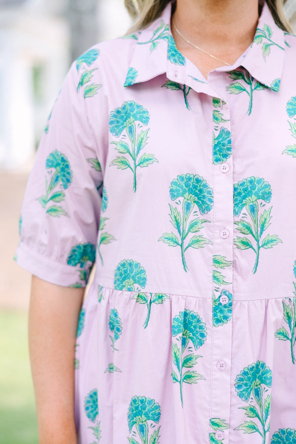 Plus Size light pink midi dress with a green floral print, button-up front, and tiered skirt.