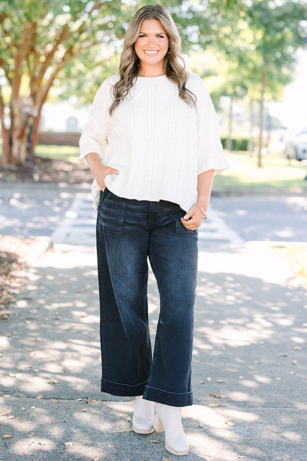 Plus Size black wide-leg jeggings with front patch pockets and cuffed hems.