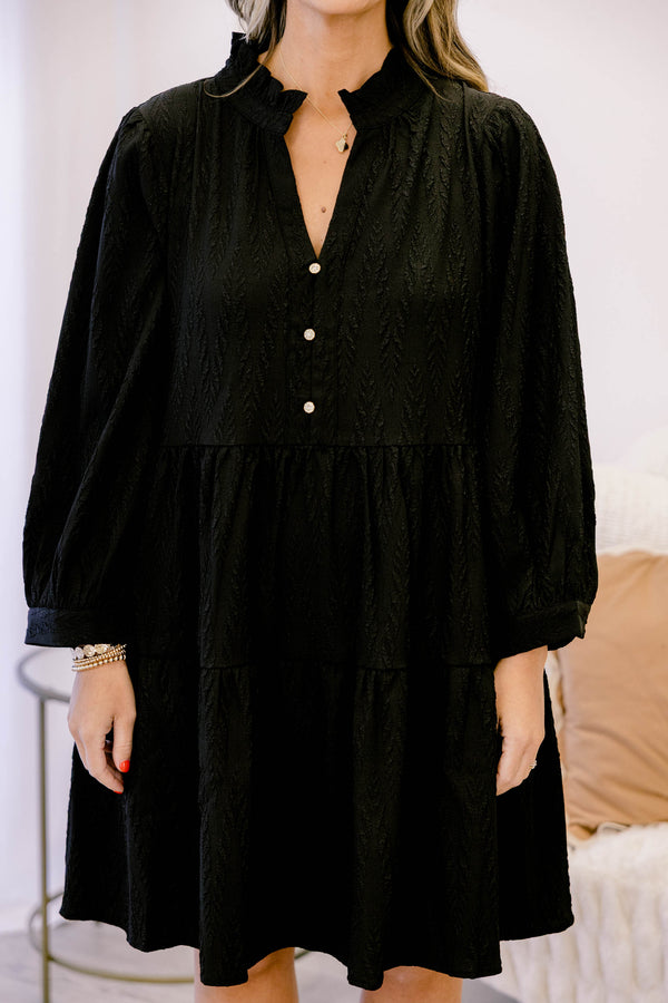 Chic Soul plus size clothing, black long sleeve short tiered dress with v neckline and 3 buttons below the neckline and a small collar