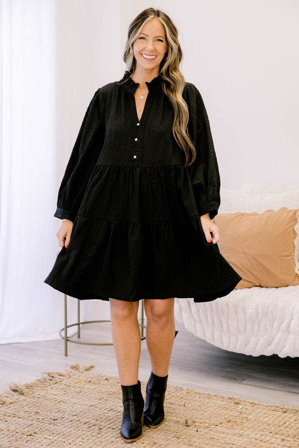 Chic Soul plus size clothing, black long sleeve short tiered dress with v neckline and 3 buttons below the neckline and a small collar