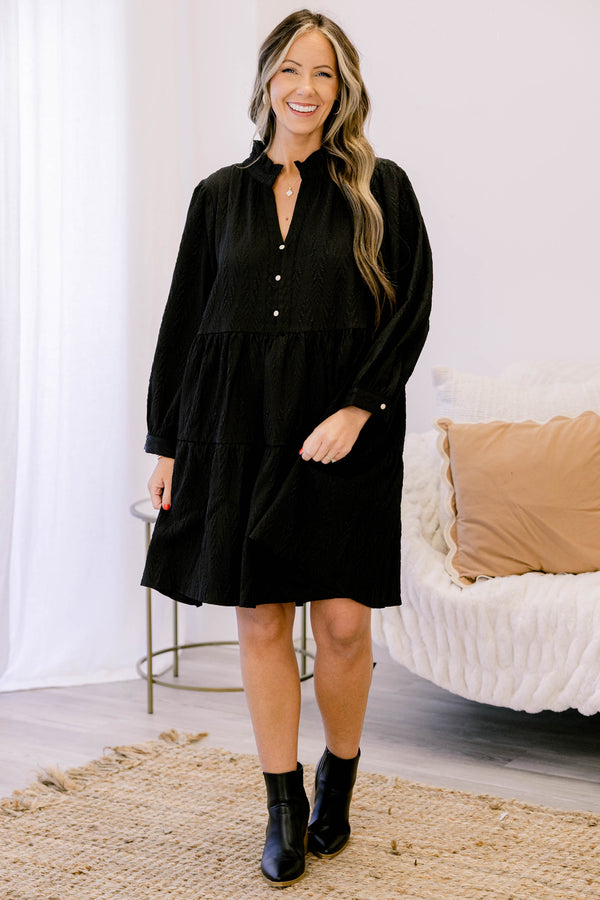 Chic Soul plus size clothing, black long sleeve short tiered dress with v neckline and 3 buttons below the neckline and a small collar