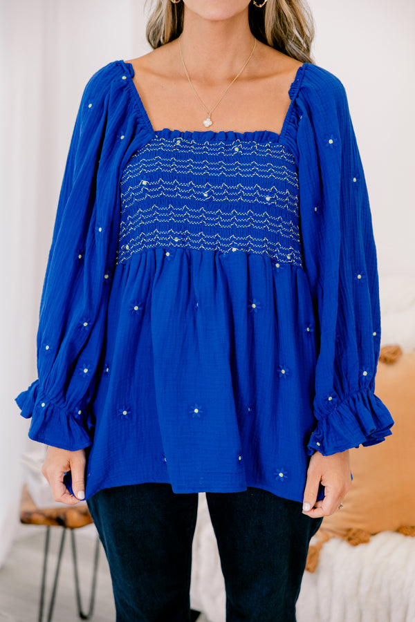 Chic Soul plus size clothing, blue long sleeve top with a square neckline that has white stitching details and white and blue embroidered floral accents throughout 