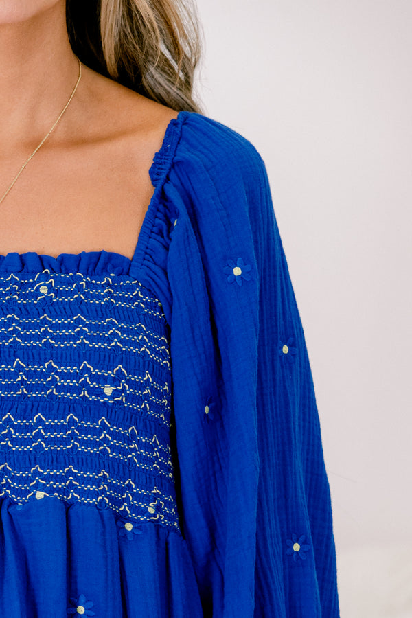 Chic Soul plus size clothing, blue long sleeve top with a square neckline that has white stitching details and white and blue embroidered floral accents throughout 