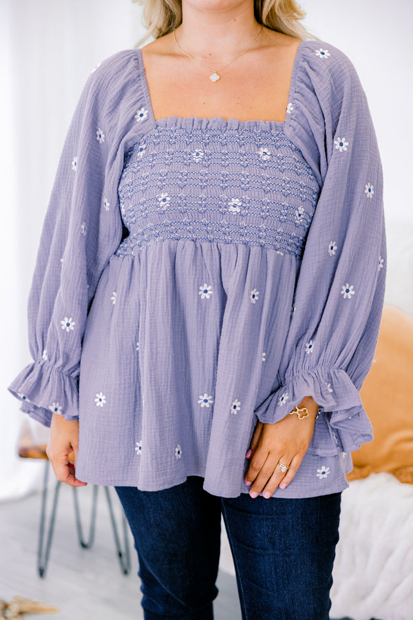 Chic Soul plus size clothing, dusty purple top with long sleeves that have a ruffle detail at the end of each sleeve and a white floral pattern throughout 