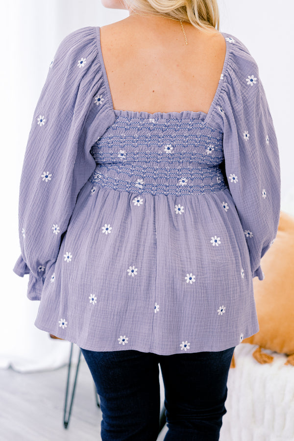Chic Soul plus size clothing, dusty purple top with long sleeves that have a ruffle detail at the end of each sleeve and a white floral pattern throughout 