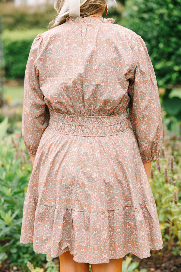 Plus Size brown floral cotton dress with a smocked waist, V-neckline, and three-quarter sleeves.