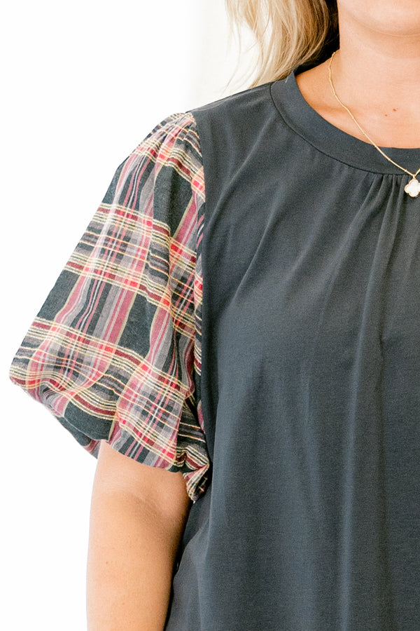 Chic Soul plus size clothing, green top with bubble sleeves that have a plaid pattern on them