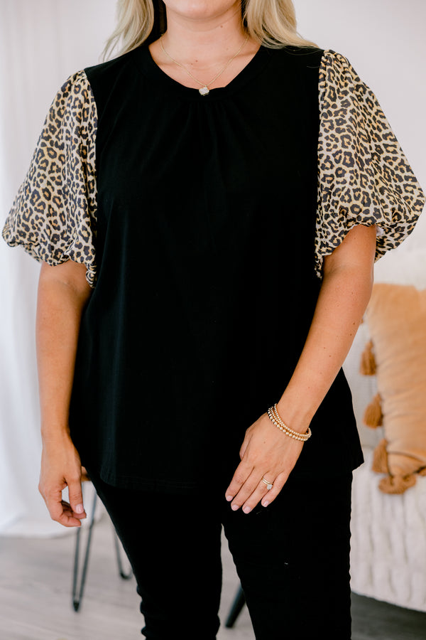 Chic soul plus size clothing, black top with bubble sleeves that have a leopard print on them 