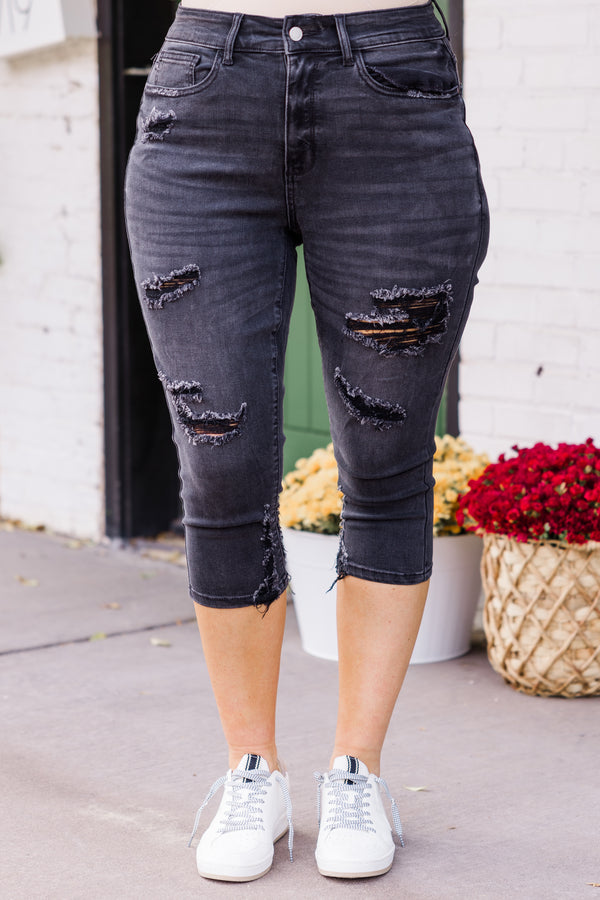 Chic Soul plus size clothing, mid-waisted black capris pants with silver button and distressed detailing 