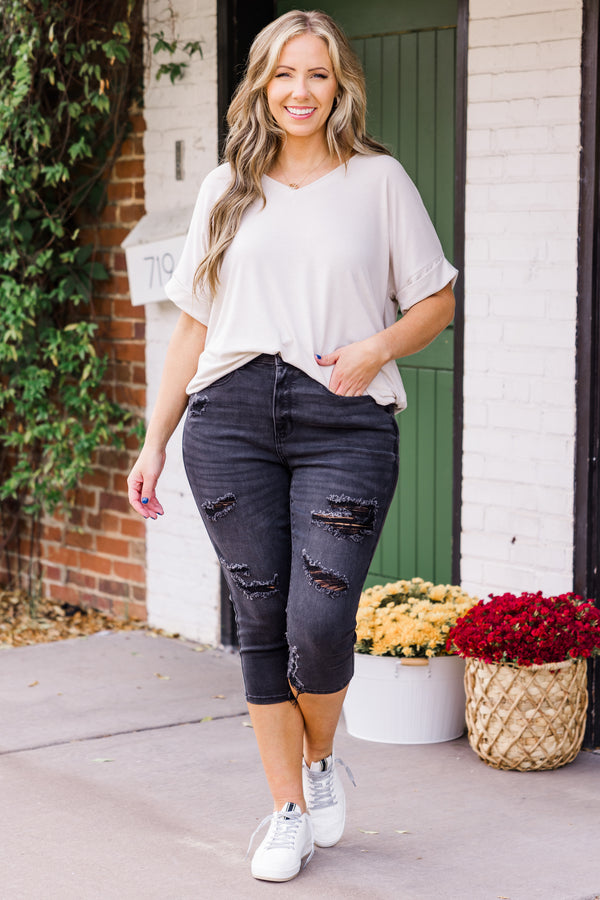Chic Soul plus size clothing, mid-waisted black capris pants with silver button and distressed detailing 