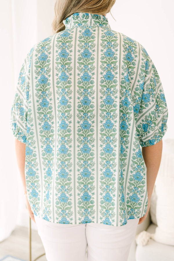 Blue floral stripe top with a ruffle collar, button-front ruffle trim, and  bubble sleeves.