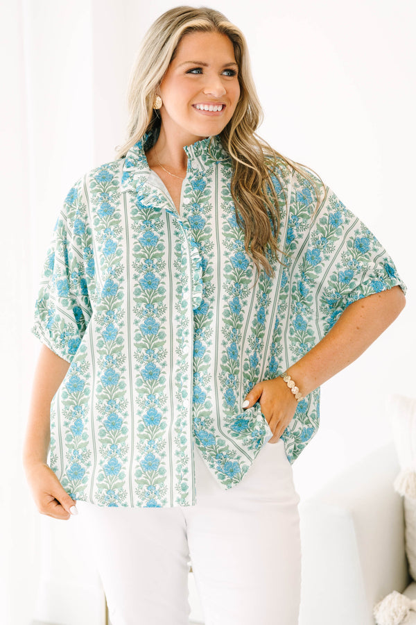 Blue floral stripe top with a ruffle collar, button-front ruffle trim, and  bubble sleeves.