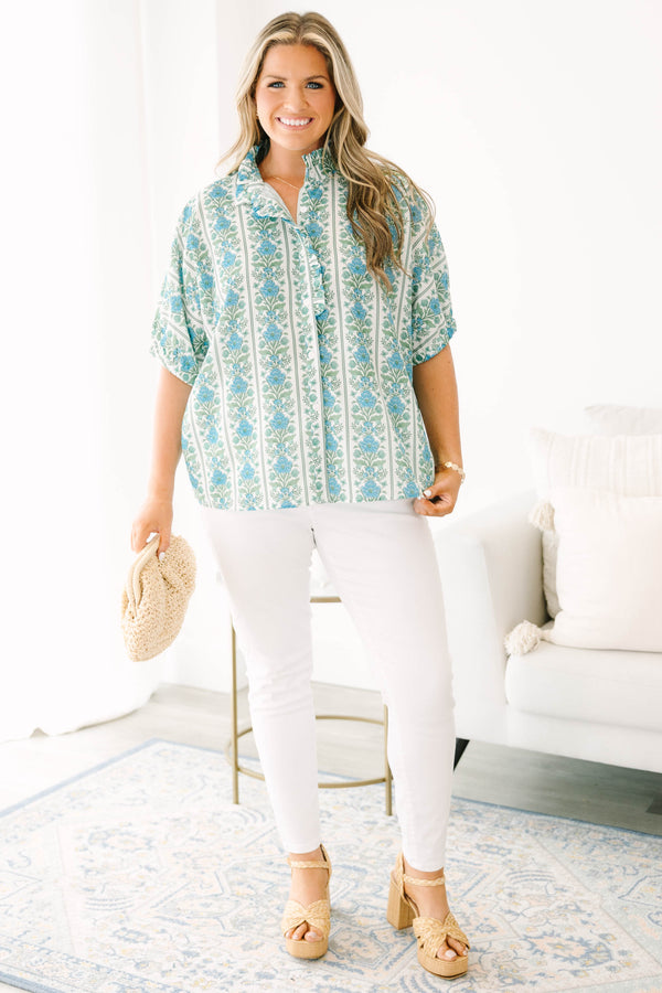 Blue floral stripe top with a ruffle collar, button-front ruffle trim, and  bubble sleeves.