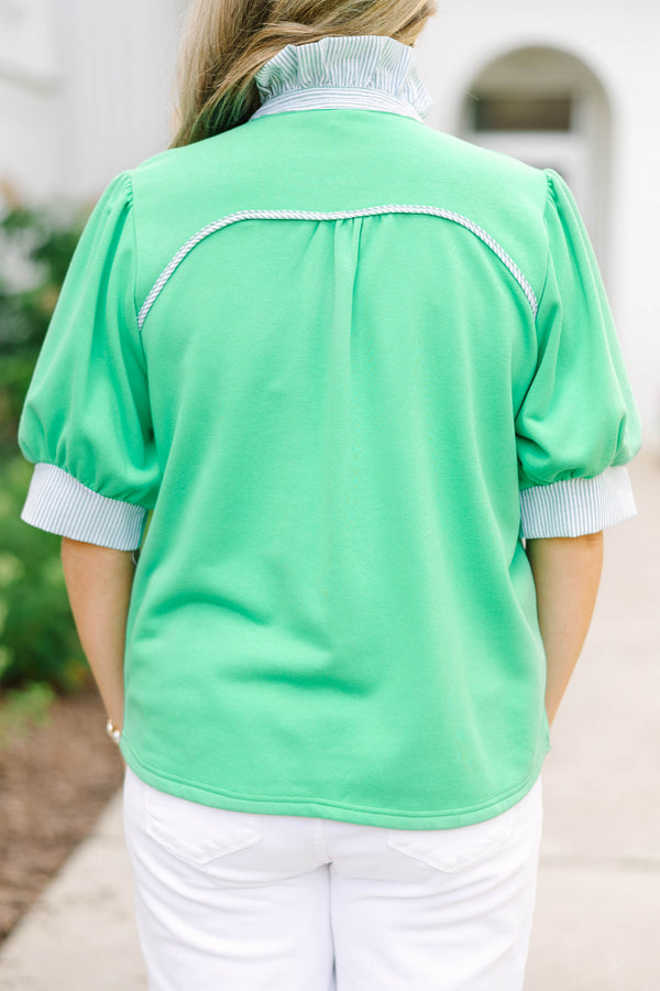 Plus size green top with blue and white striped contrast on neckline and sleeves