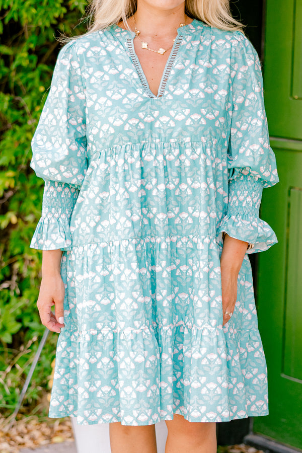Chic Soul plus size clothing, turquoise baby doll dress with half sleeves that have a ruffle on the end and a block pattern throughout