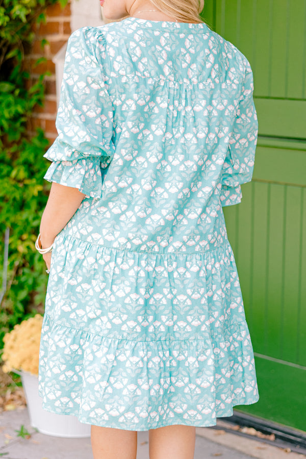 Chic Soul plus size clothing, turquoise baby doll dress with half sleeves that have a ruffle on the end and a block pattern throughout