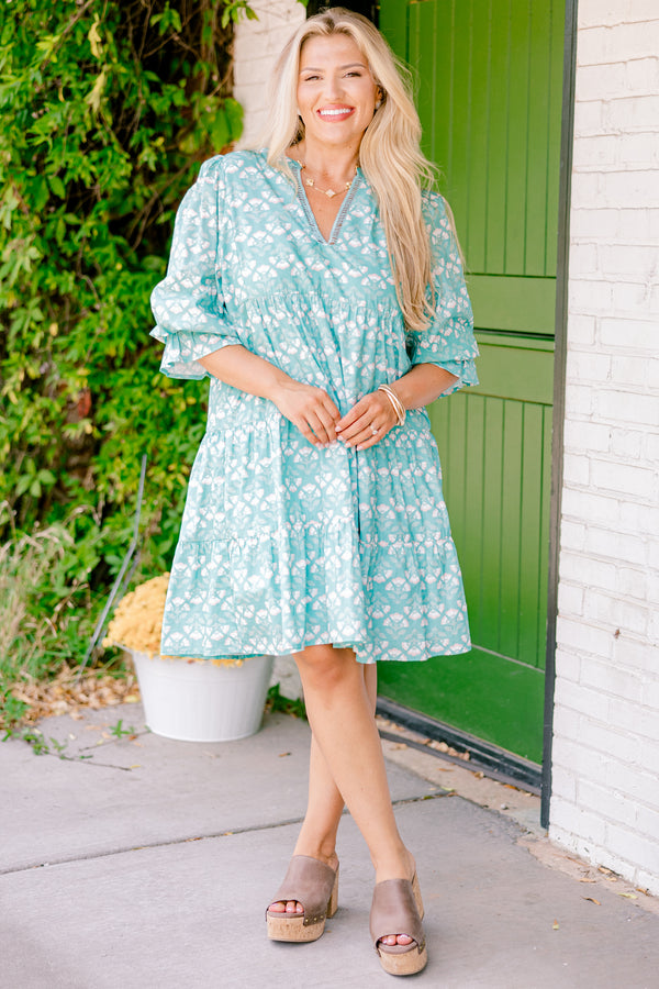 Chic Soul plus size clothing, turquoise baby doll dress with half sleeves that have a ruffle on the end and a block pattern throughout