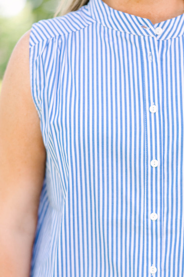 Plus Size blue and white vertical striped sleeveless button-down tank top with white denim shorts.