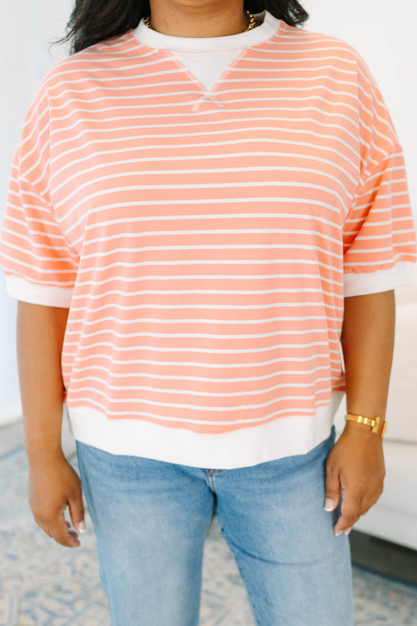 Plus Size coral and white striped short sleeve top with a crew neck and ribbed trim.