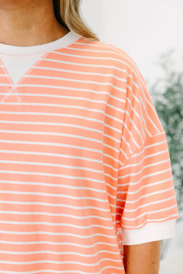 Plus Size coral and white striped short sleeve top with a crew neck and ribbed trim.