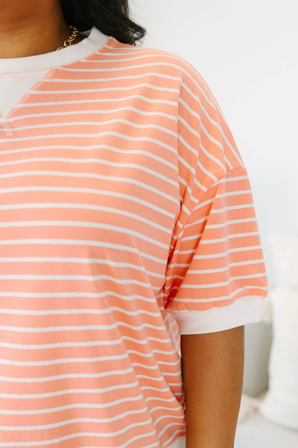 Plus Size coral and white striped short sleeve top with a crew neck and ribbed trim.