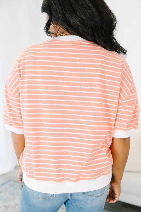 Plus Size coral and white striped short sleeve top with a crew neck and ribbed trim.