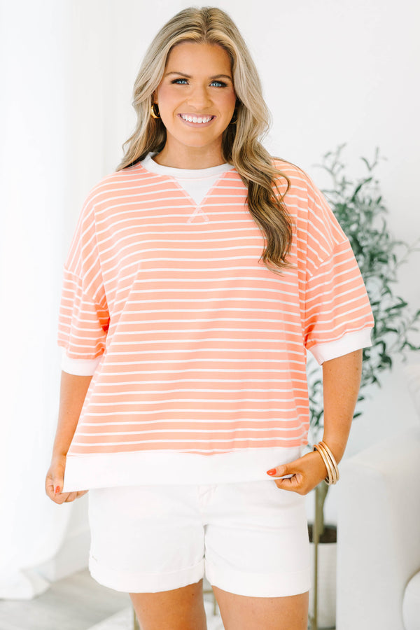 Plus Size coral and white striped short sleeve top with a crew neck and ribbed trim.
