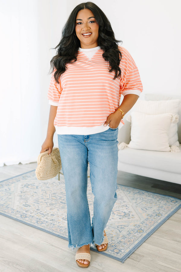 Plus Size coral and white striped short sleeve top with a crew neck and ribbed trim.