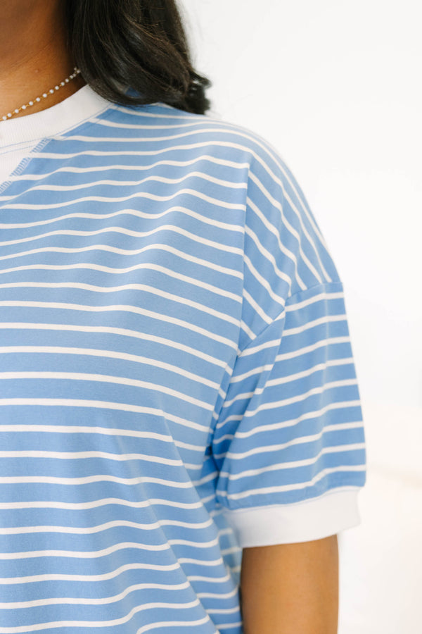 Plus Size cornflower blue and white striped short sleeve top with a white crew neck and hem.