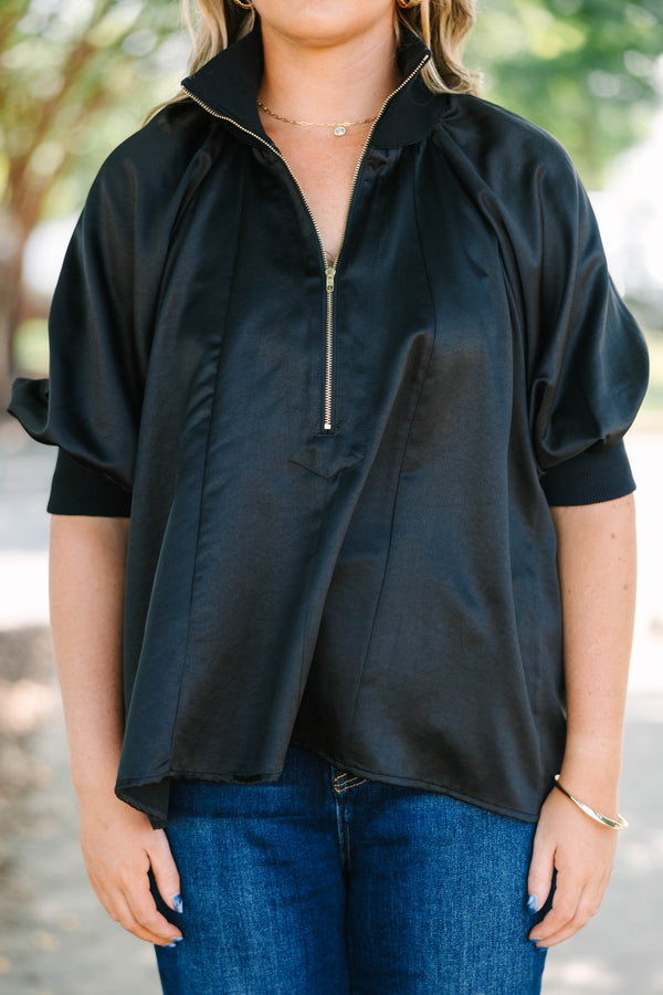 Plus Size black satin-finish top with a half-zip neckline, high collar, and short puff sleeves.