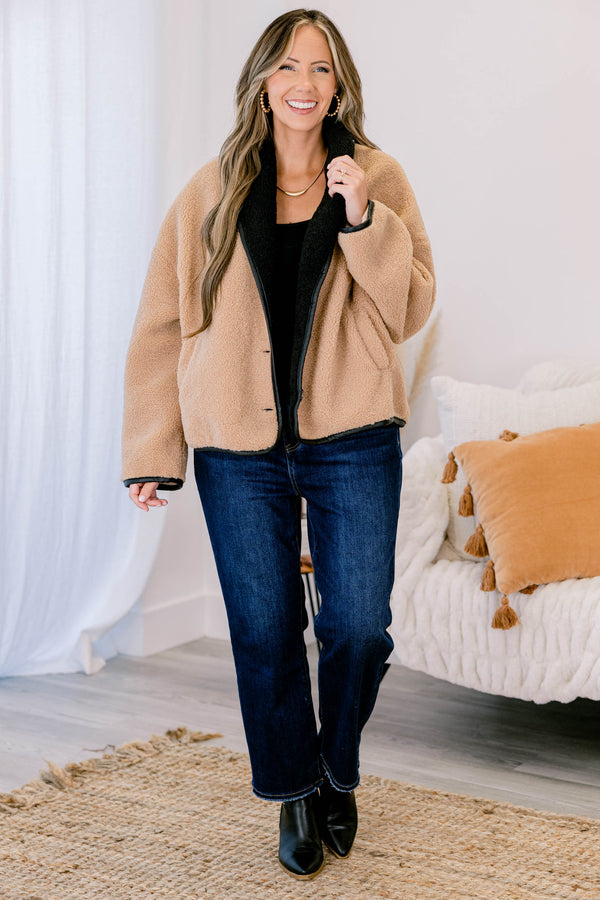 Chic Soul plus size clothing, camel fur colored jacket that has black details going around the ends of each sleeve and on the bottom of the jacket as well as button details going down the left side of the jacket 