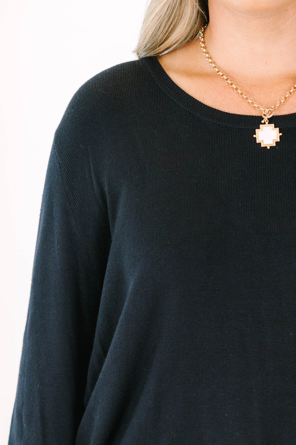 Plus Size black long sleeve sweater with a crew neckline and relaxed fit in a soft knit fabric.