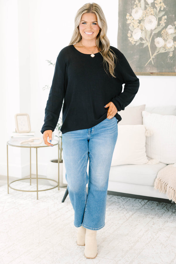 Plus Size black long sleeve sweater with a crew neckline and relaxed fit in a soft knit fabric.