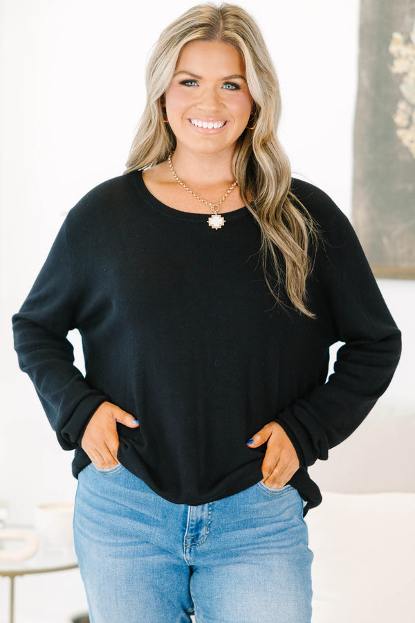 Plus Size black long sleeve sweater with a crew neckline and relaxed fit in a soft knit fabric.