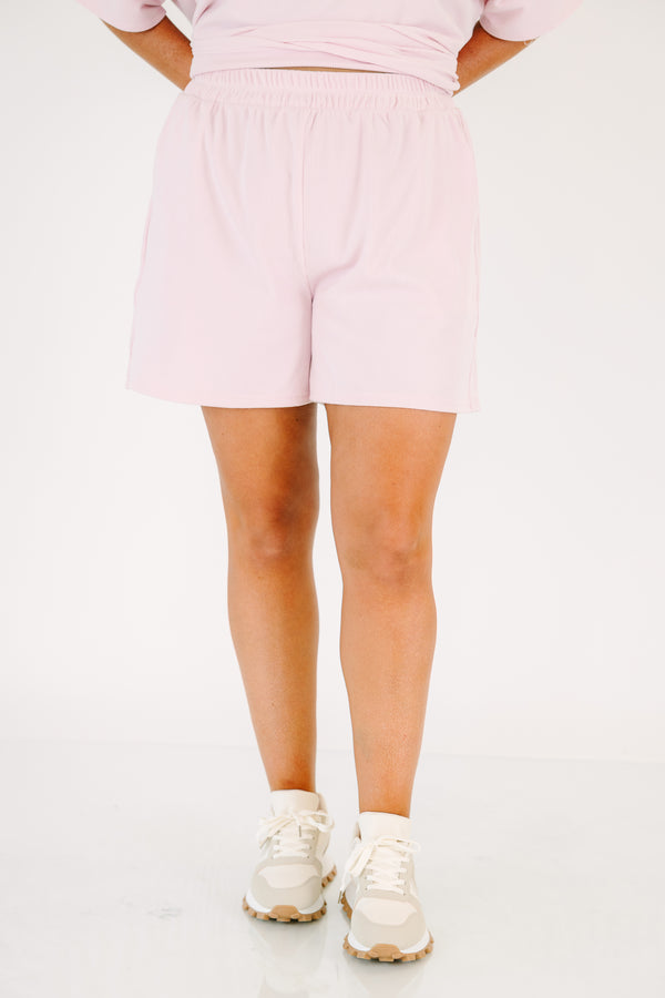 Plus Size pink two-piece lounge set with a short-sleeve ribbed top and matching pull-on shorts.