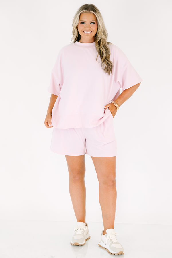 Plus Size pink two-piece lounge set with a short-sleeve ribbed top and matching pull-on shorts.