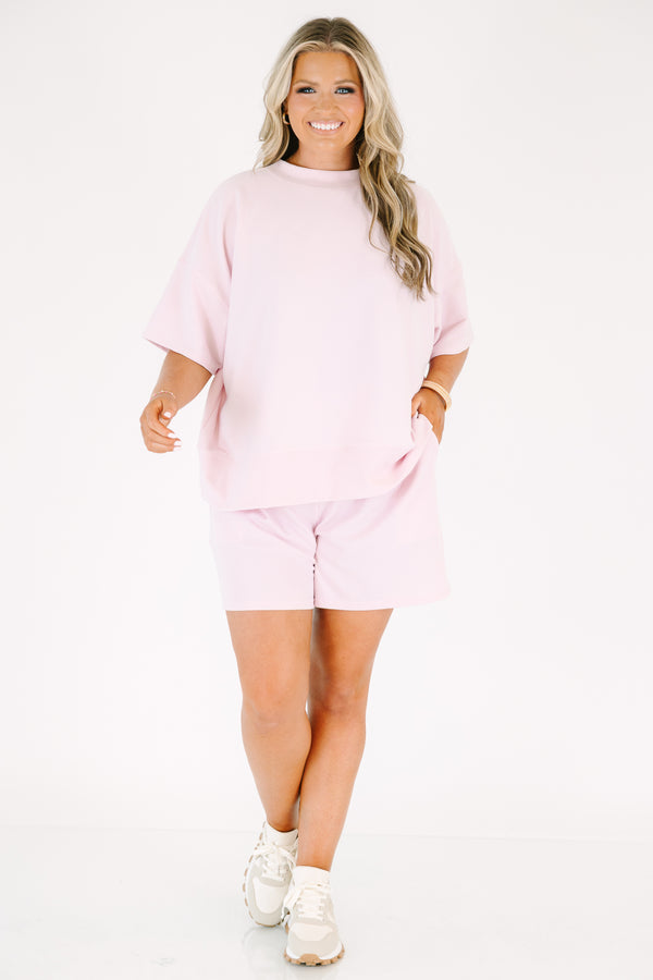 Plus Size pink two-piece lounge set with a short-sleeve ribbed top and matching pull-on shorts.