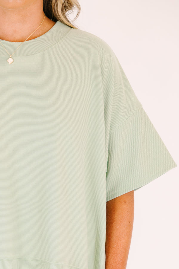 Plus Size sage green two-piece set with a short-sleeve ribbed top and matching pull-on shorts.