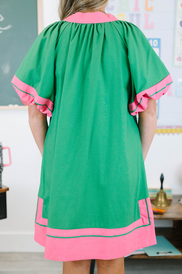 Plus size Kelly Green Dress with pink trim, split v-neck, and flowy silhouette.