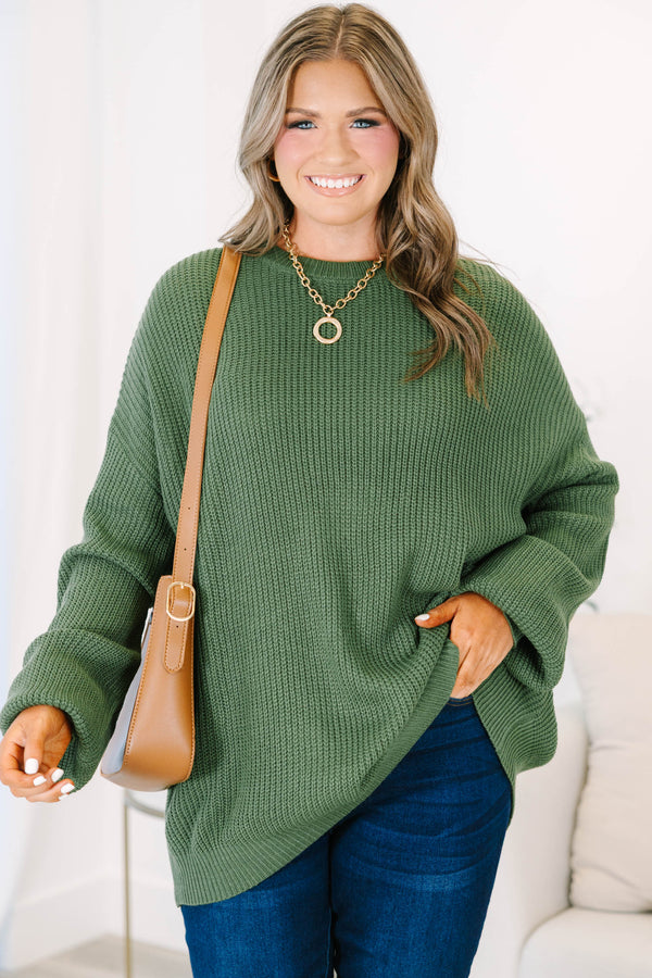 Plus size olive green oversized knit sweater with a relaxed fit and crew neckline.