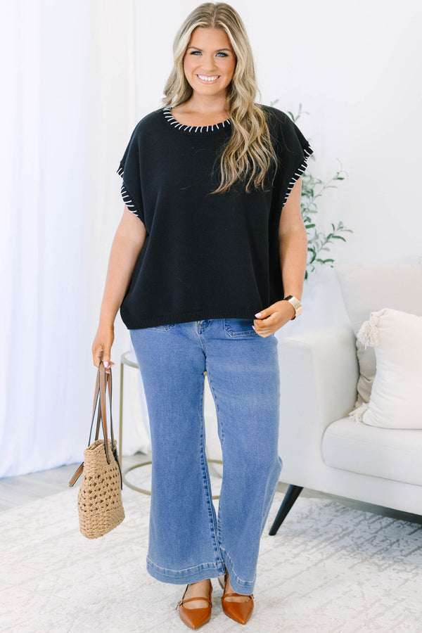 Plus Size black short sleeve knit top with white whipstitch detailing on the neckline and sleeves.