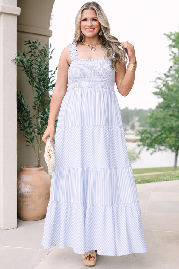 Plus Size blue and white striped maxi dress with a smocked bodice and tiered skirt.