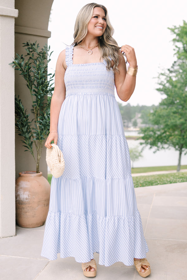 Plus Size blue and white striped maxi dress with a smocked bodice and tiered skirt.