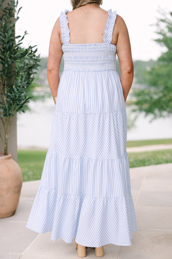Plus Size blue and white striped maxi dress with a smocked bodice and tiered skirt.